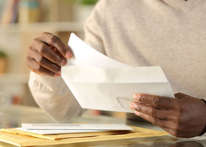 Man receiving check after estate sales in Detroit